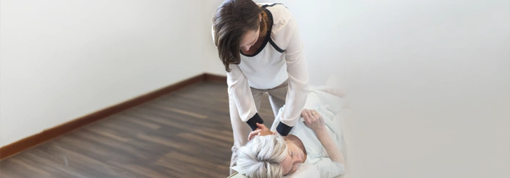 Chiropractor Saint Johns FL Leslie Lynn Performing Adjustment On Senior Woman Chiropractor Leslie Lynn Performing Adjustment On Senior Woman
